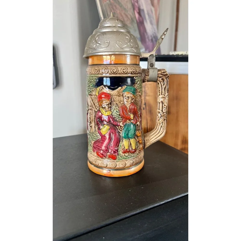 Vintage German musical beer stein,  embossed painted scenes, hinged pewter lid